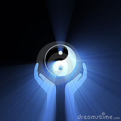 hand-holding-yin-yang-sign-light-flare-11151435